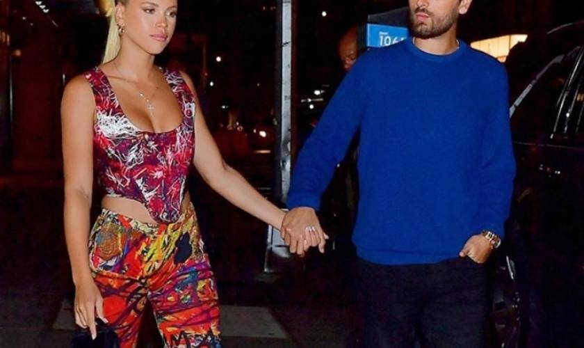 Scott Disick Gives Sofia Richie A LovingLook As She Stuns In Electric CutoutJumpsuit & Sleek Updo