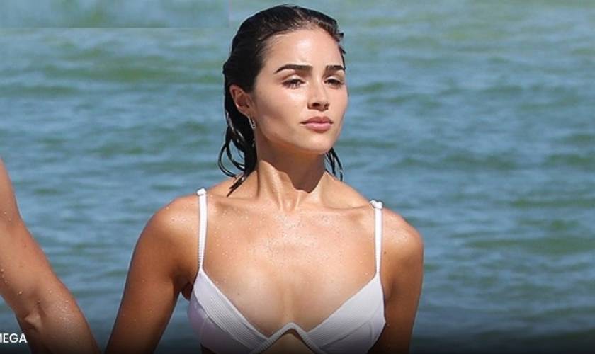 Olivia Culpo Rocks White Crop Top WithNothing Underneath In BTS Look At ‘SISwimsuit’ Shoot
