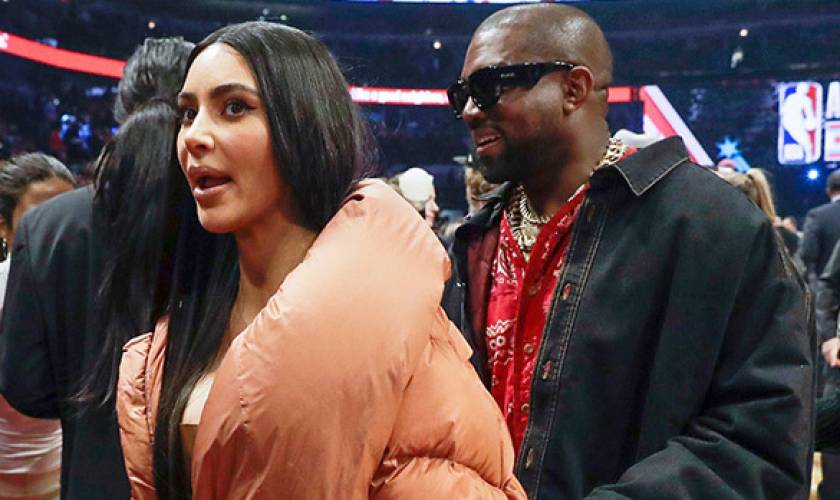 Kim Kardashian Stuns In A Bold OrangeLook While Cozying Up With Kanye At TheNBA All
